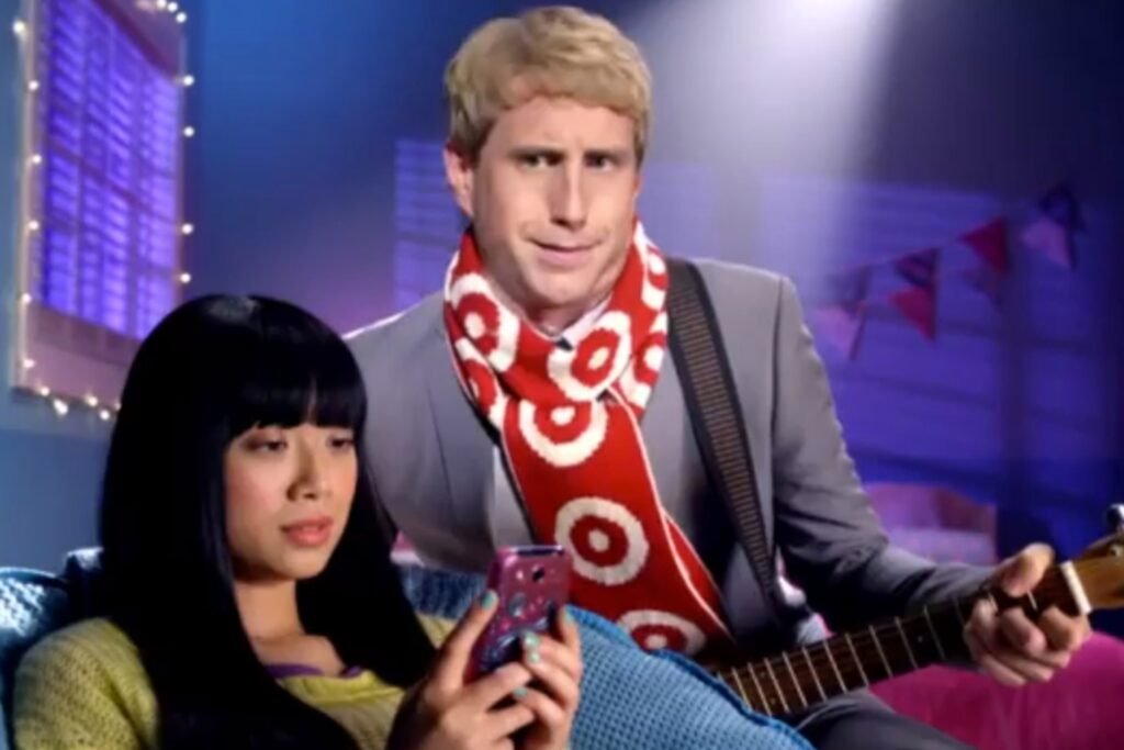 Still shot of Target commercial featuring a red and white knitted scarf lined with targets